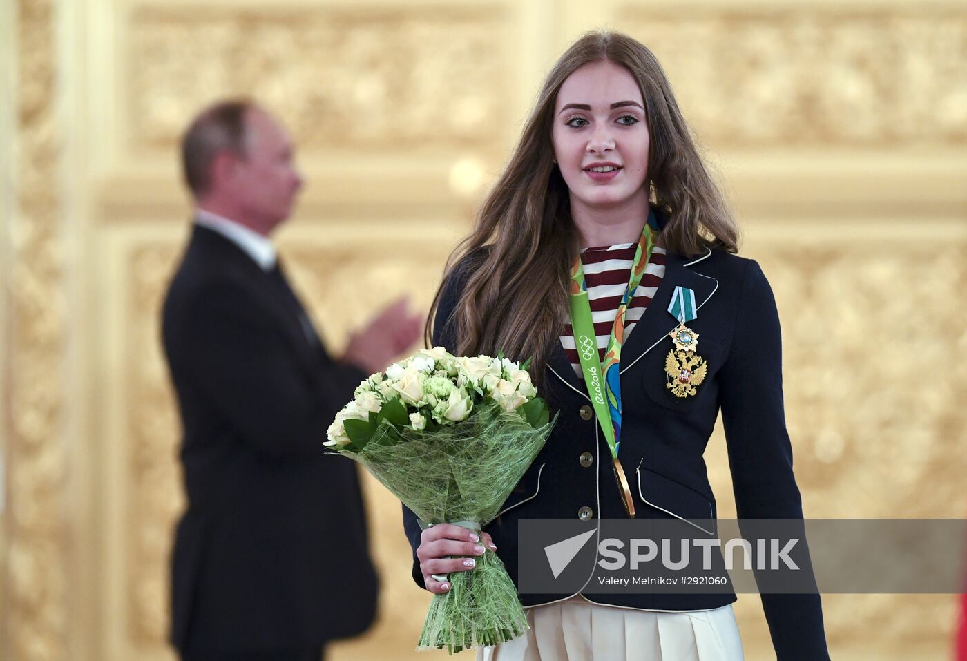 President Vladimir Putin gives government awards to Olympic medalists