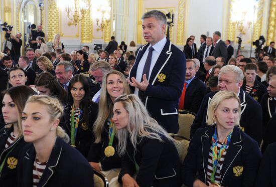 President Vladimir Putin gives government awards to Olympic medalists