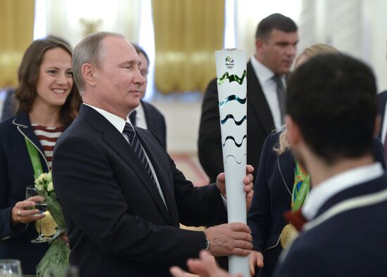 President Vladimir Putin gives government awards to Olympic medalists