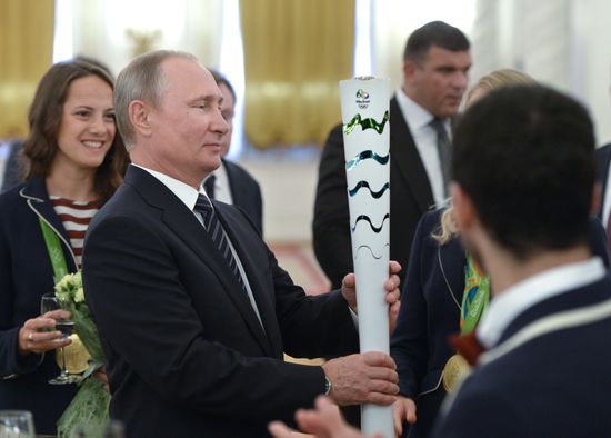 President Vladimir Putin gives government awards to Olympic medalists
