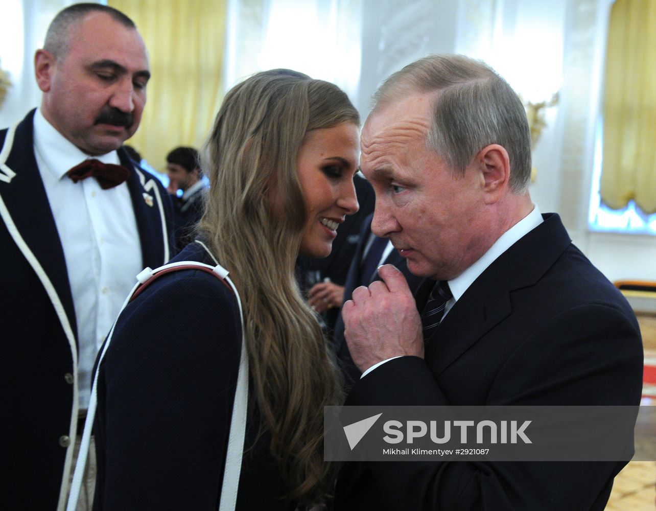 President Vladimir Putin gives government awards to Olympic medalists