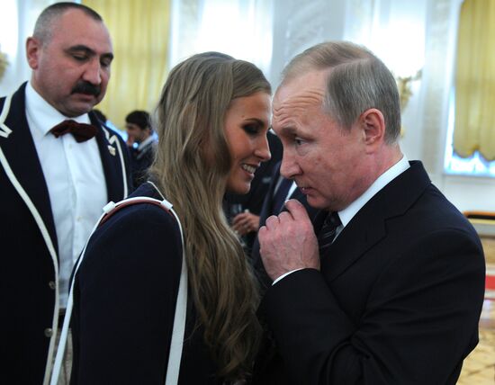President Vladimir Putin gives government awards to Olympic medalists
