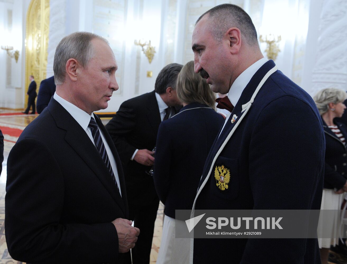 President Vladimir Putin gives government awards to Olympic medalists