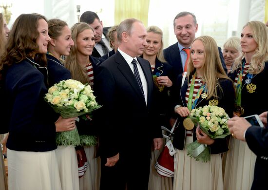 President Vladimir Putin gives government awards to Olympic medalists