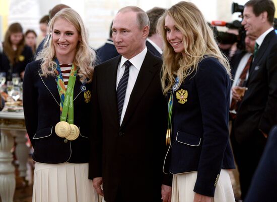 President Vladimir Putin gives government awards to Olympic medalists