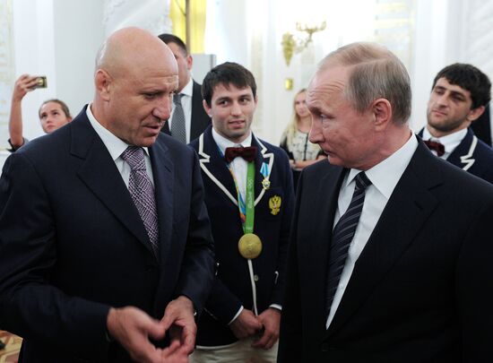 President Vladimir Putin gives government awards to Olympic medalists