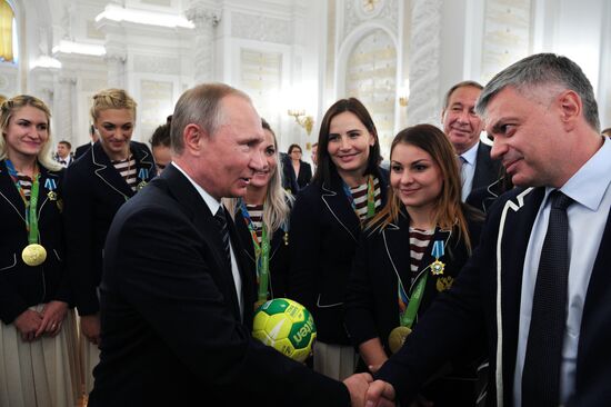 President Vladimir Putin gives government awards to Olympic medalists