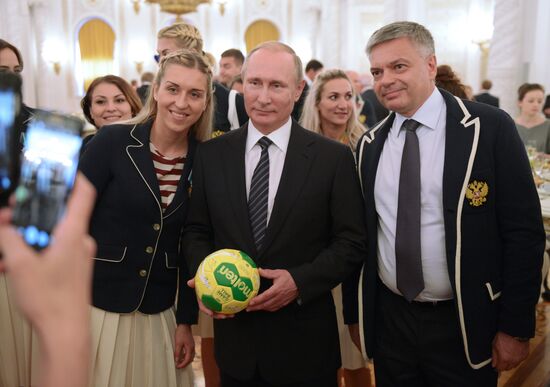 President Vladimir Putin gives government awards to Olympic medalists