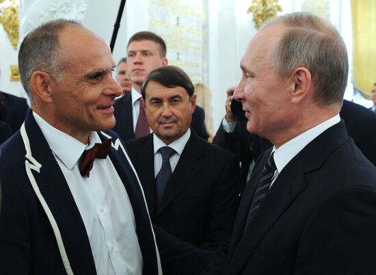 President Vladimir Putin gives government awards to Olympic medalists