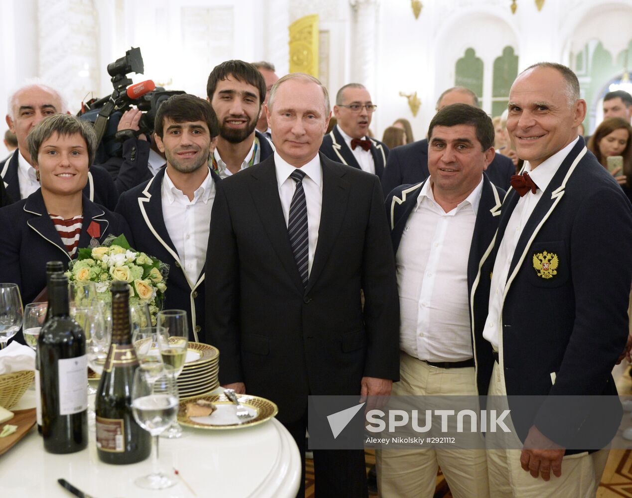 President Vladimir Putin gives government awards to Olympic medalists