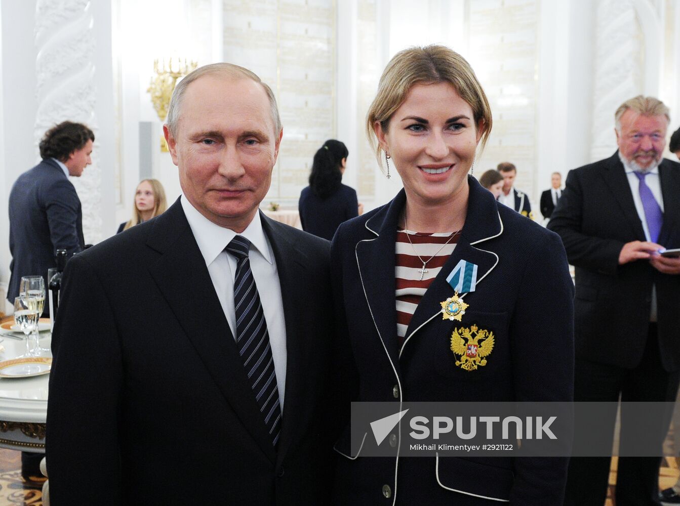 President Vladimir Putin gives government awards to Olympic medalists