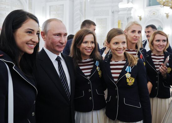 President Vladimir Putin gives government awards to Olympic medalists