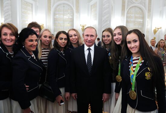 President Vladimir Putin gives government awards to Olympic medalists