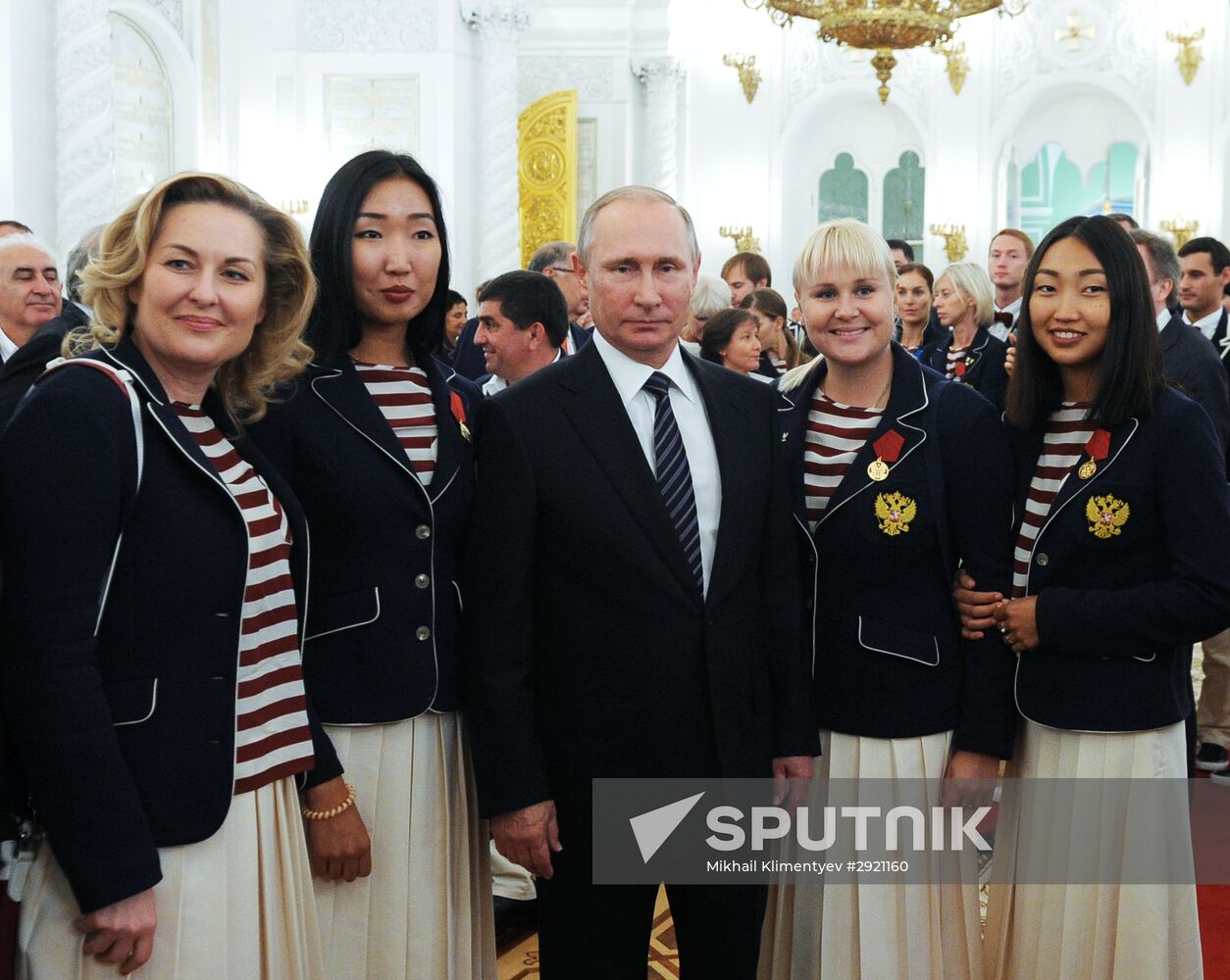 President Vladimir Putin gives government awards to Olympic medalists