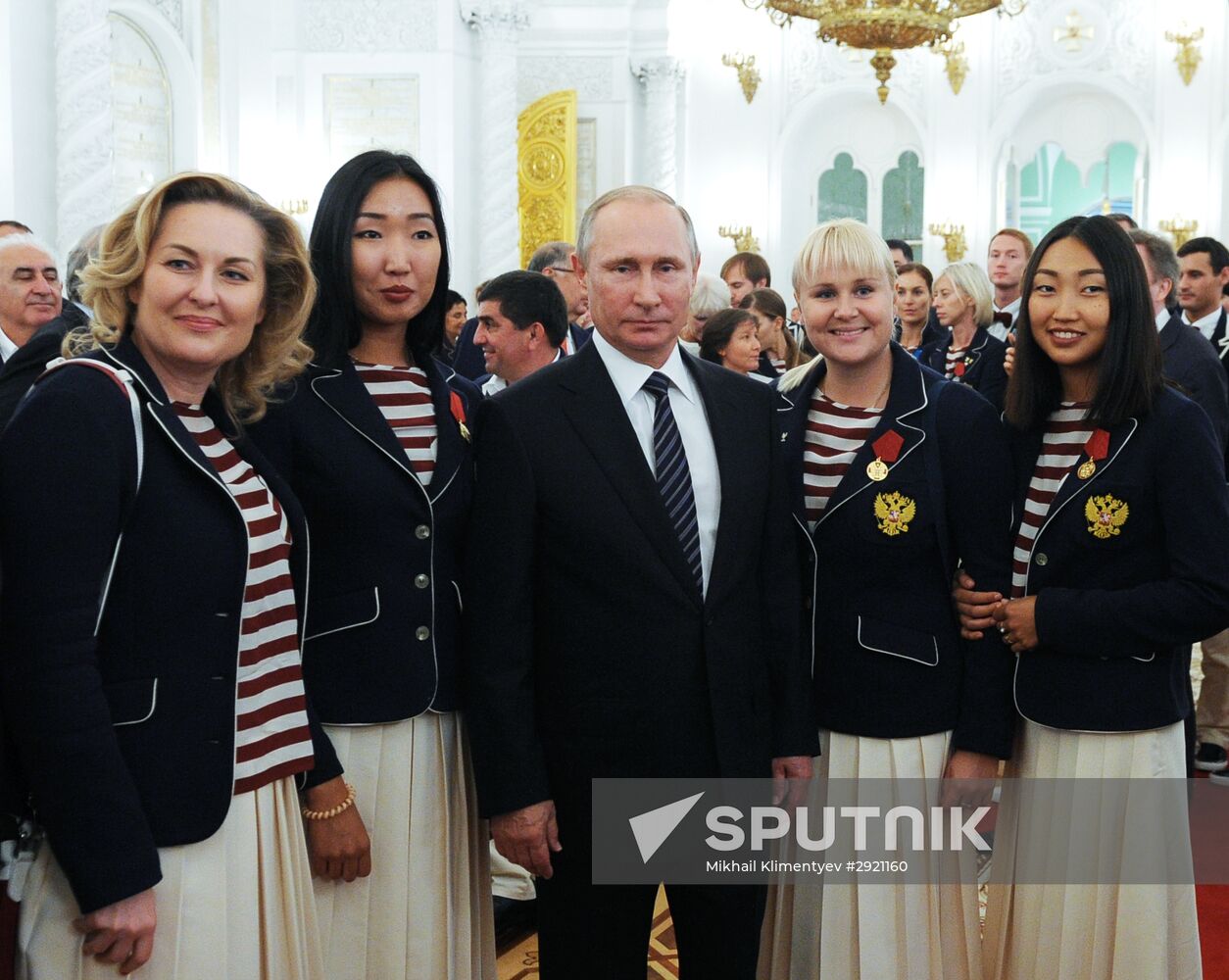 President Vladimir Putin gives government awards to Olympic medalists