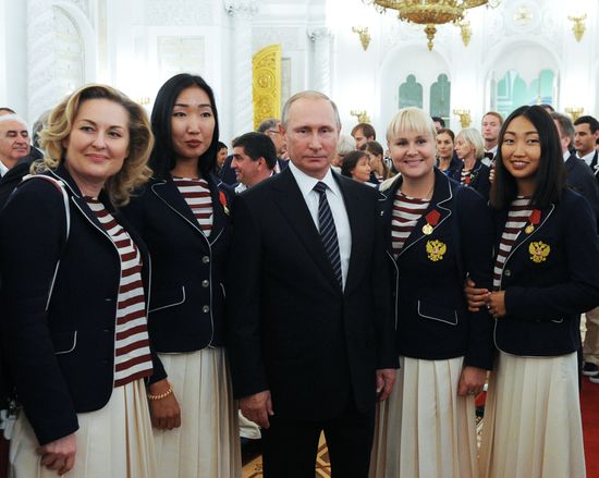 President Vladimir Putin gives government awards to Olympic medalists