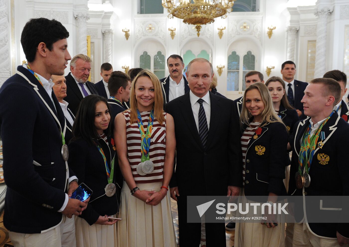 President Vladimir Putin gives government awards to Olympic medalists