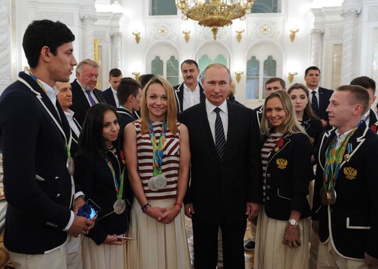 President Vladimir Putin gives government awards to Olympic medalists