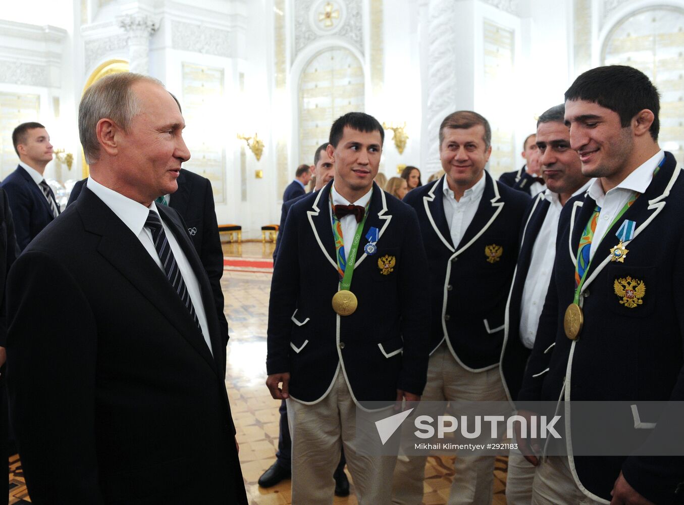 President Vladimir Putin gives government awards to Olympic medalists
