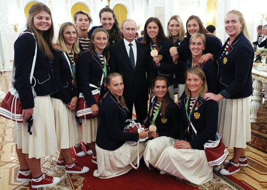 President Vladimir Putin gives government awards to Olympic medalists