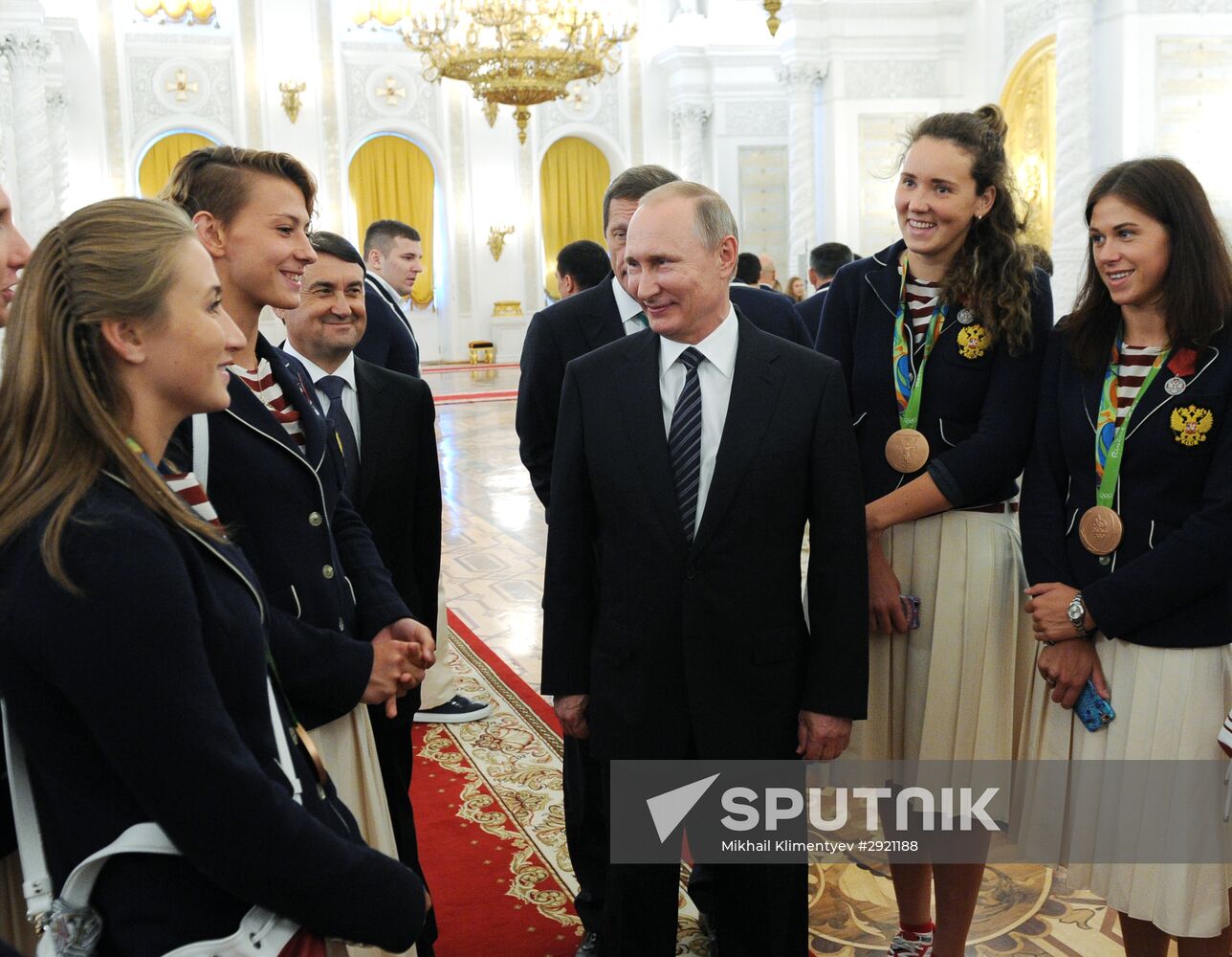 President Vladimir Putin gives government awards to Olympic medalists