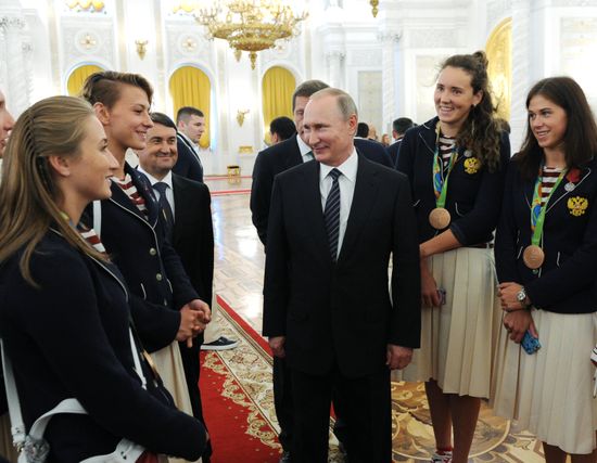 President Vladimir Putin gives government awards to Olympic medalists
