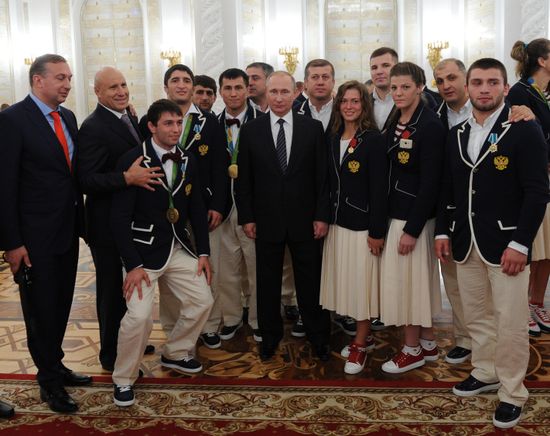 President Vladimir Putin gives government awards to Olympic medalists
