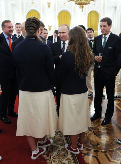 President Vladimir Putin gives government awards to Olympic medalists