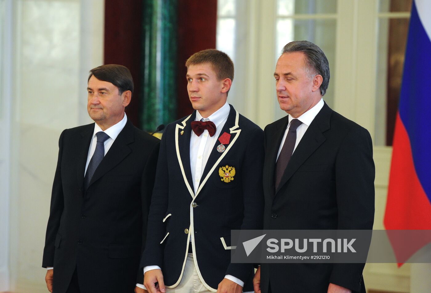 President Vladimir Putin gives government awards to Olympic medalists