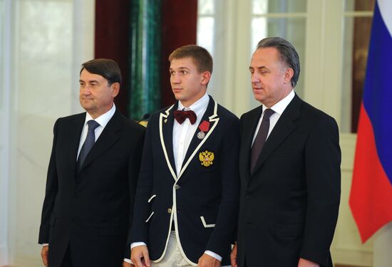 President Vladimir Putin gives government awards to Olympic medalists