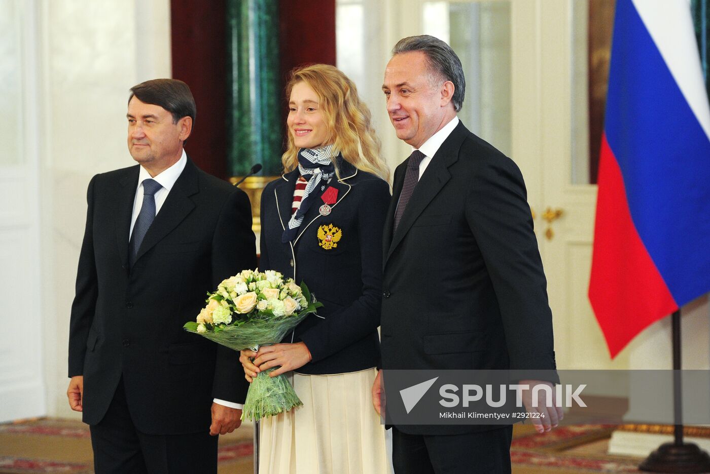 President Vladimir Putin gives government awards to Olympic medalists