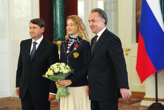 President Vladimir Putin gives government awards to Olympic medalists