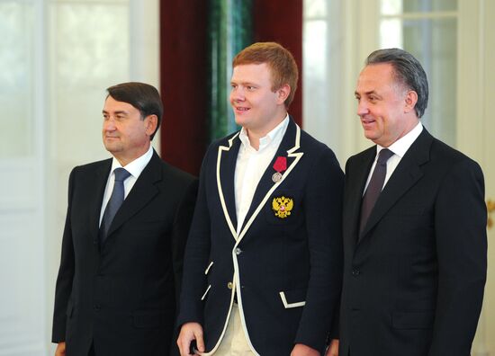 President Vladimir Putin gives government awards to Olympic medalists