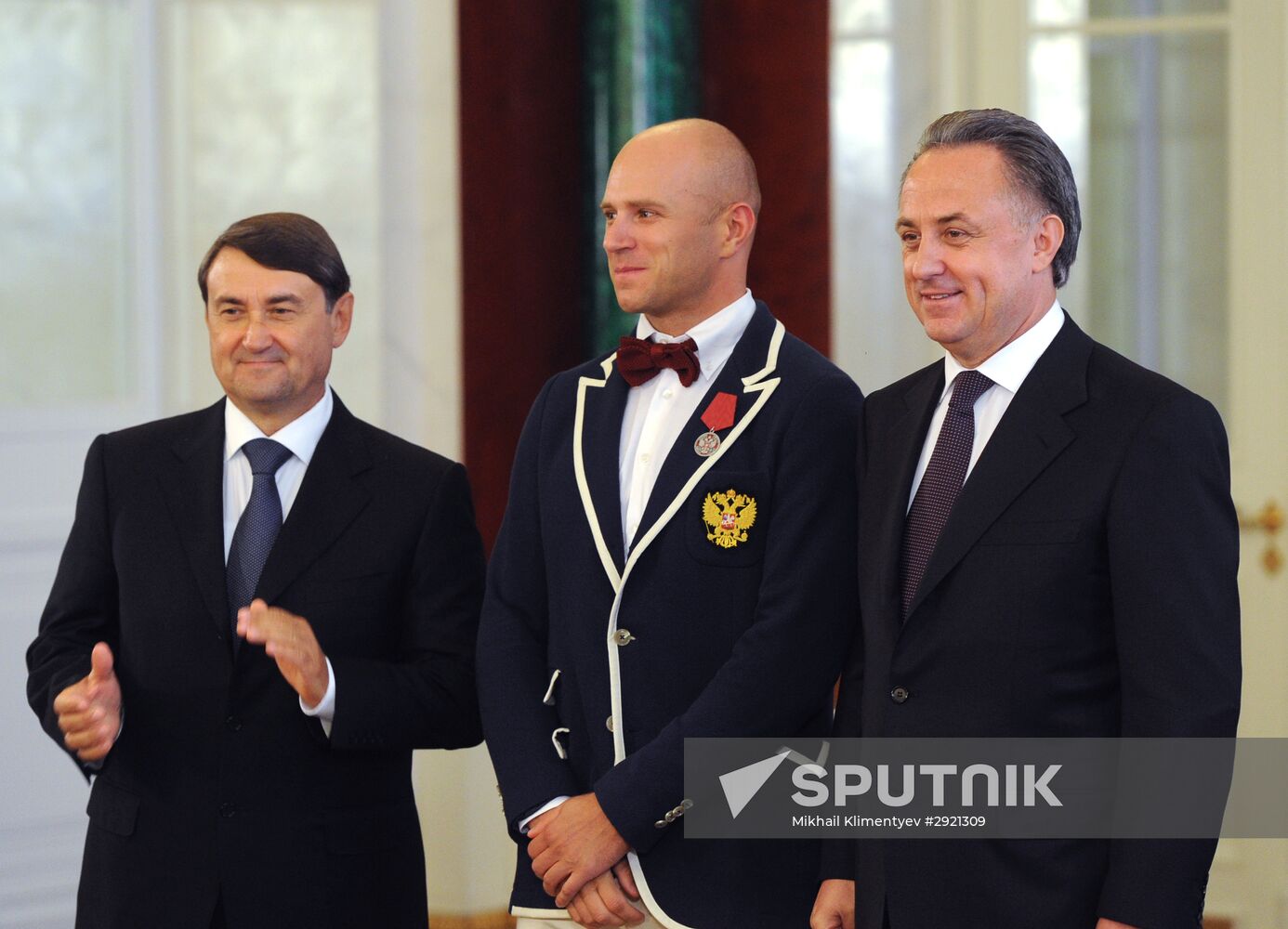 President Vladimir Putin gives government awards to Olympic medalists