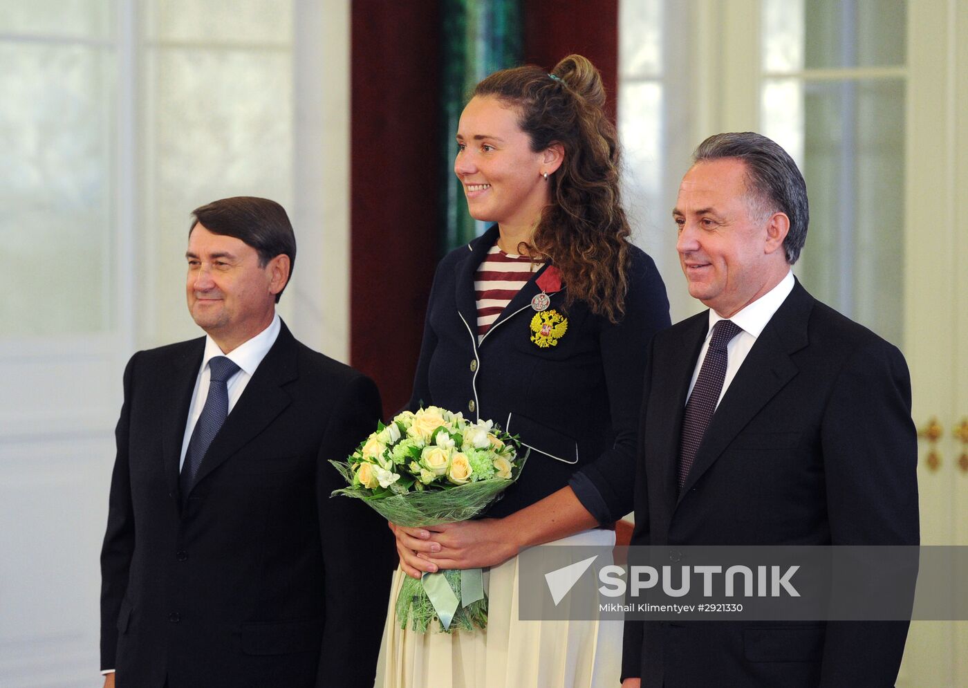 President Vladimir Putin gives government awards to Olympic medalists