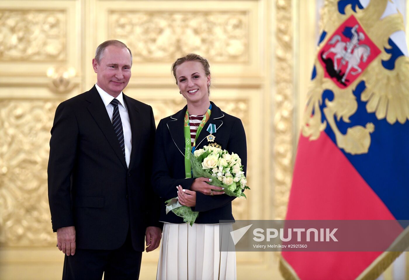 President Vladimir Putin gives government awards to Olympic medalists