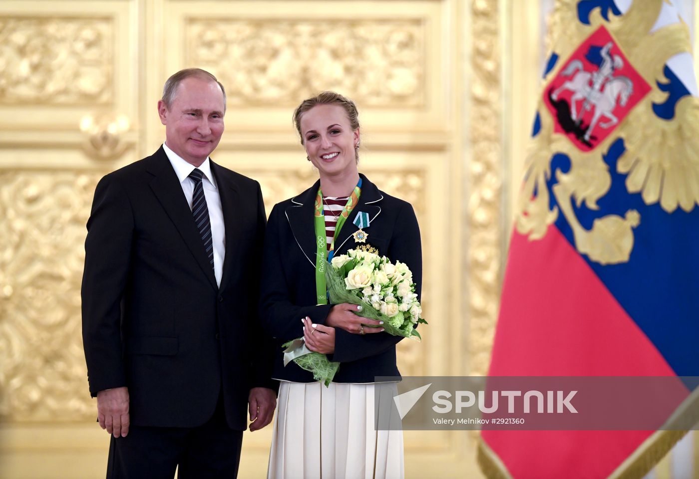 President Vladimir Putin gives government awards to Olympic medalists