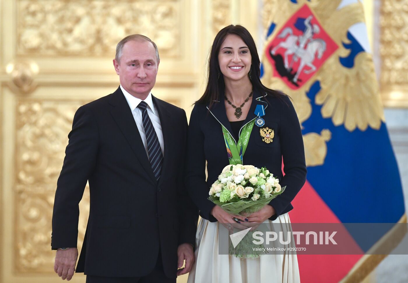 President Vladimir Putin gives government awards to Olympic medalists
