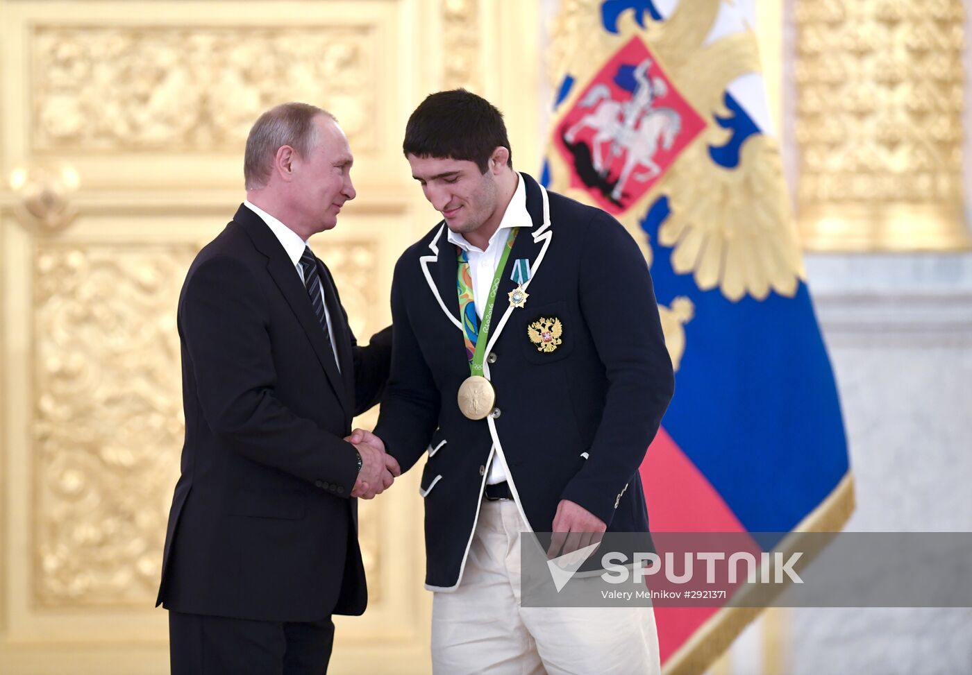 President Vladimir Putin gives government awards to Olympic medalists