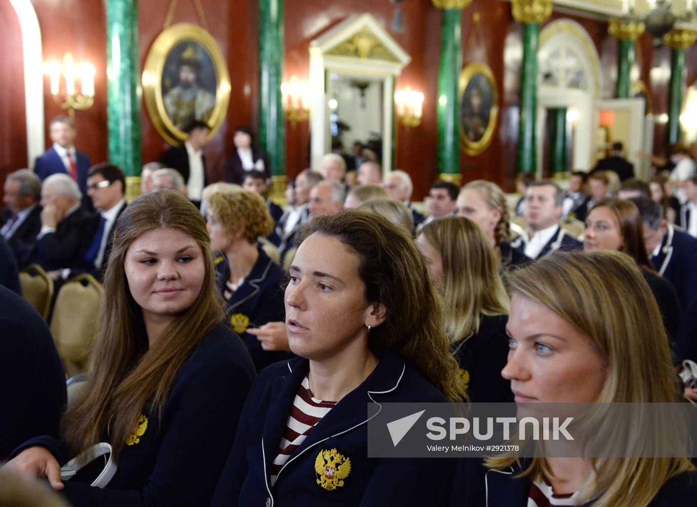 President Vladimir Putin gives government awards to Olympic medalists