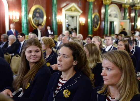 President Vladimir Putin gives government awards to Olympic medalists