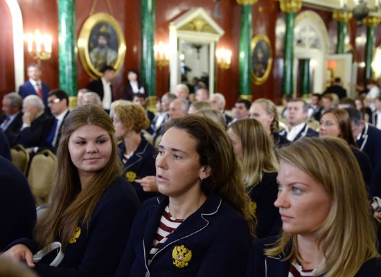 President Vladimir Putin gives government awards to Olympic medalists