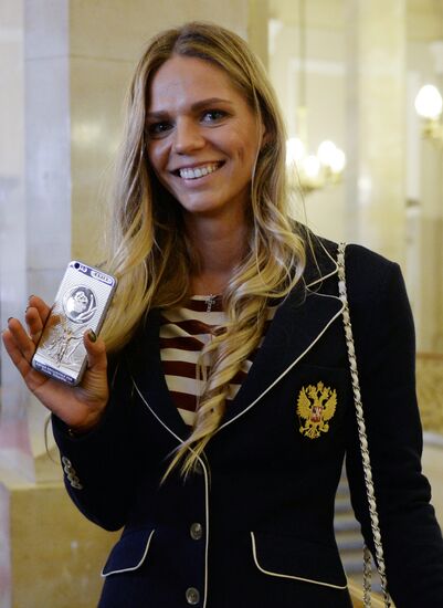 President Vladimir Putin gives government awards to Olympic medalists