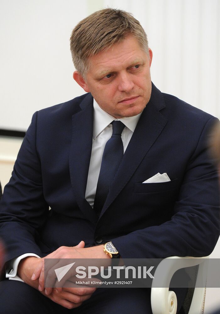 Russian President Vladimir Putin meets with Slovak Prime Minister Robert Fico