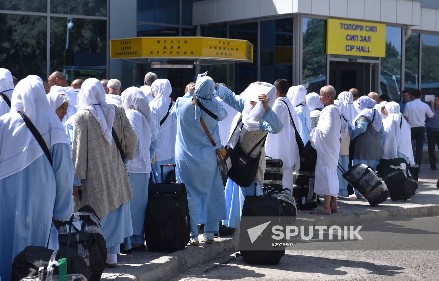 Tajik pilgrims in Dushanbe airport heading to Hajj