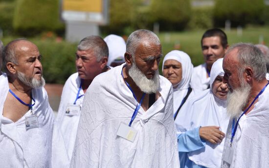 Tajik pilgrims in Dushanbe airport heading to Hajj