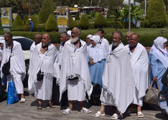 Tajik pilgrims in Dushanbe airport heading to Hajj