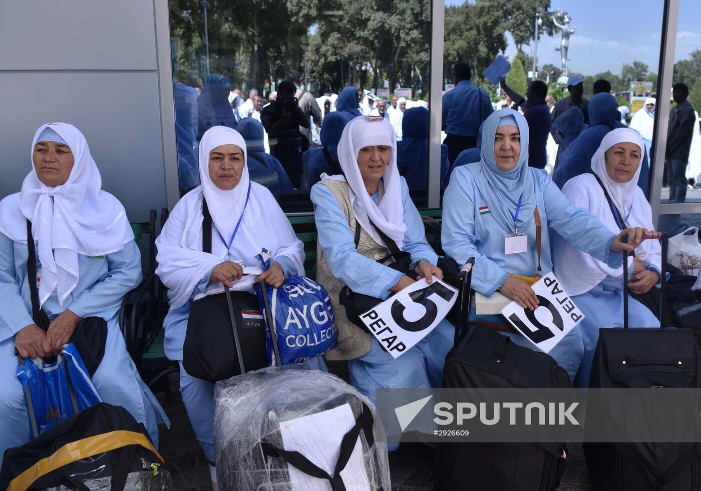 Tajik pilgrims in Dushanbe airport heading to Hajj