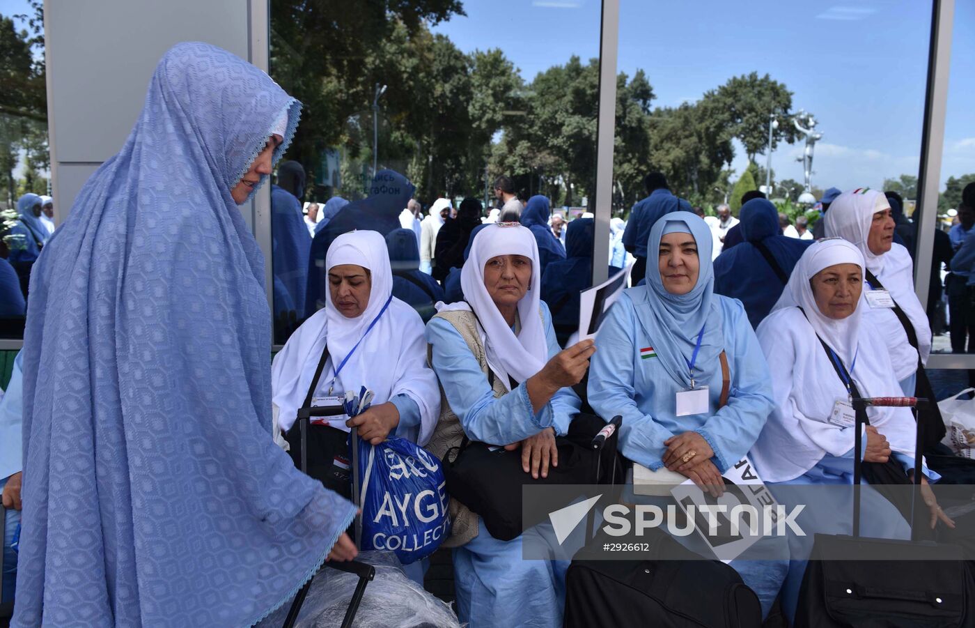 Tajik pilgrims in Dushanbe airport heading to Hajj