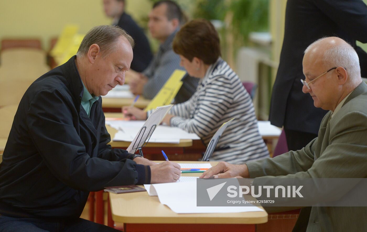 Public and political leaders vote on general election day